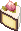 yellow cake with white frosting and a strawberry slice