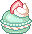 mint macaron with white cream and a strawberry slice