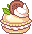 vanilla macaron with white cream and a brown spice cookie